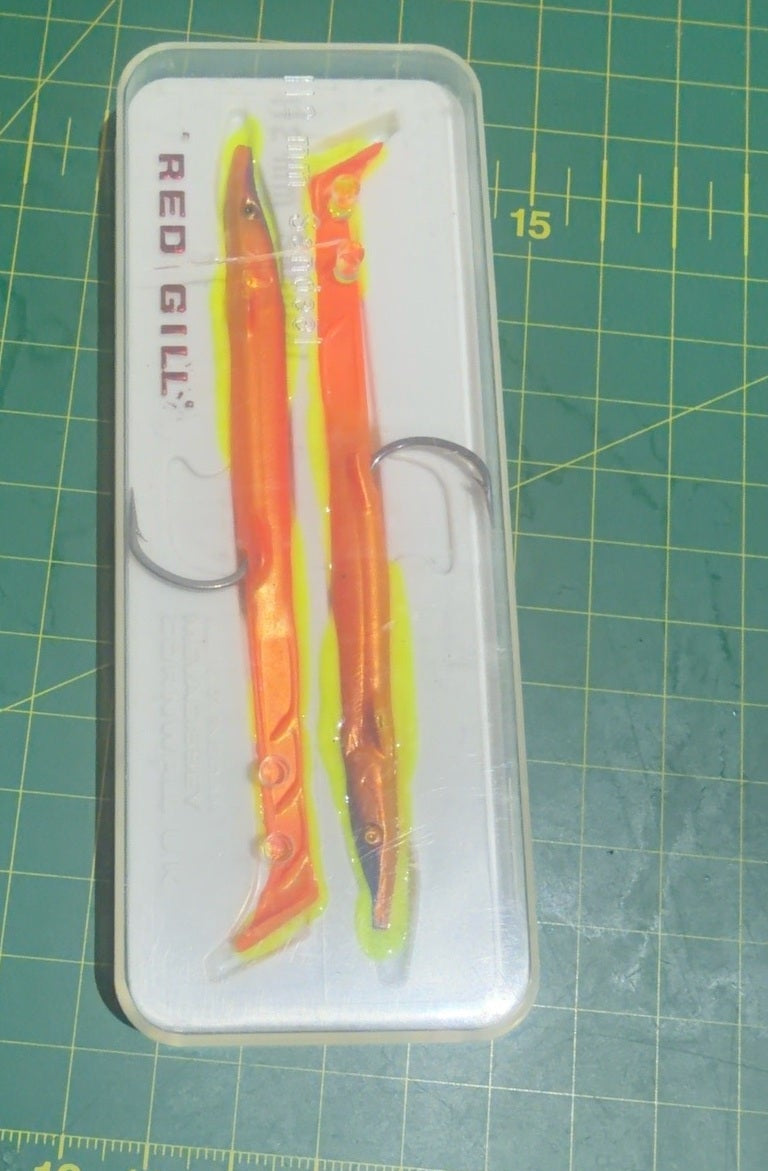 Vintage Red Gill fishing lures in original case, age-deteriorated and for collector display only